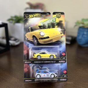 Hot Wheels Premium Hammer Drop combo featuring Porsche 911 Carrera RS 2.7 and MG Metro 6R4 with Metal/Metal build and Real Riders tyres. Collector-grade diecast set available at The Miniature Hub.